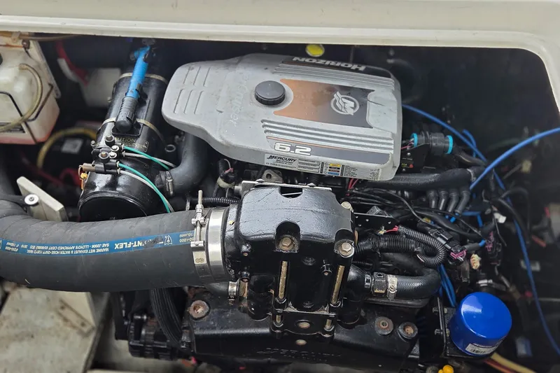Slide: The Image of Engine compartment of a 2007 Cruisers Yachts 340 Express, featuring a 6.2-liter engine. - 55