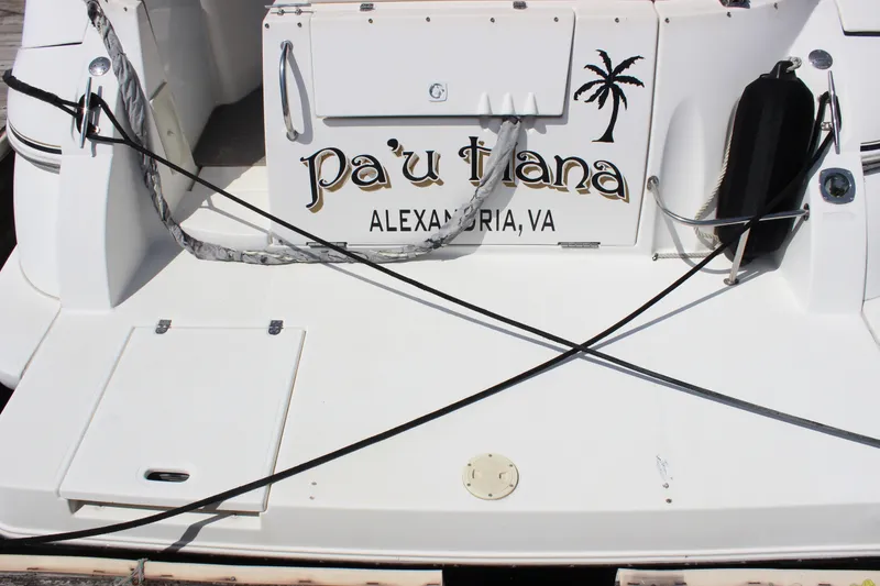 Slide: The Image of 2007 Cruisers Yachts 340 Express boat stern with name "Pa'u Hana," docked in Alexandria, VA. - 3