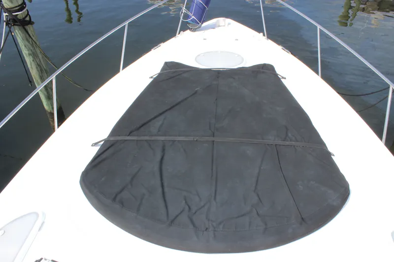Slide: The Image of 2007 Cruisers Yachts 340 Express bow with black cover on deck. - 25