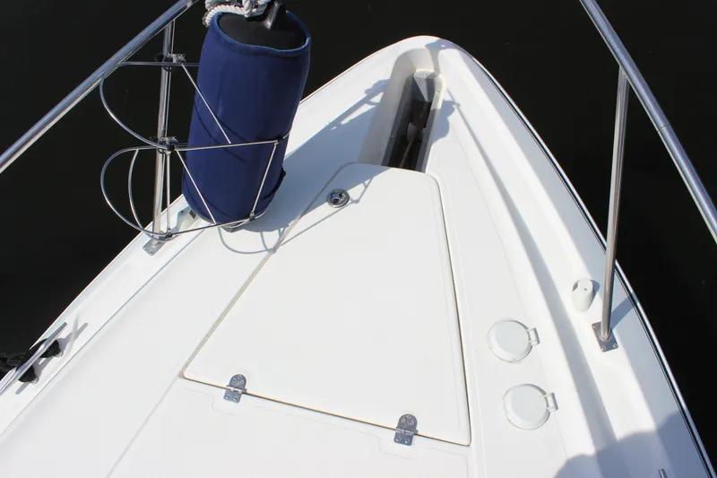 Slide: The Image of Bow view of 2007 Cruisers Yachts 340 Express, featuring sleek design and stainless steel railings. - 26
