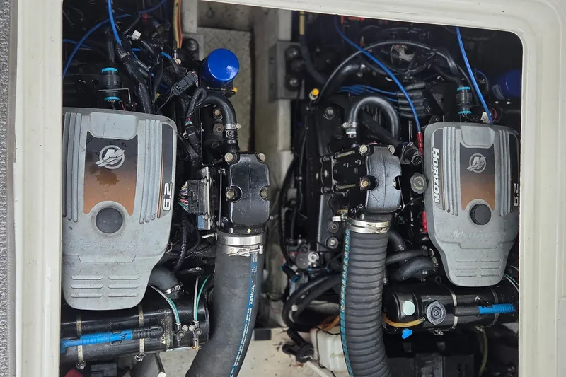Slide: The Image of Twin MerCruiser engines in a 2007 Cruisers Yachts 340 Express boat. - 52