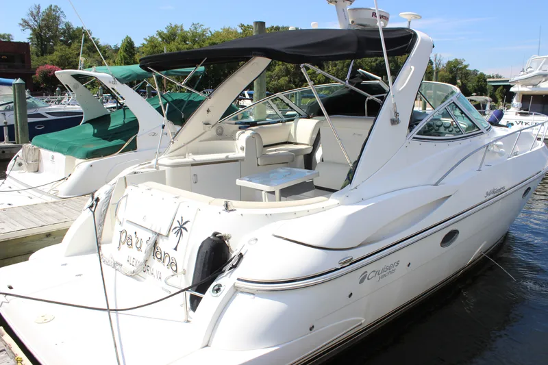 Slide: The Image of 2007 Cruisers Yachts 340 Express docked, featuring sleek design and spacious seating area. - 4