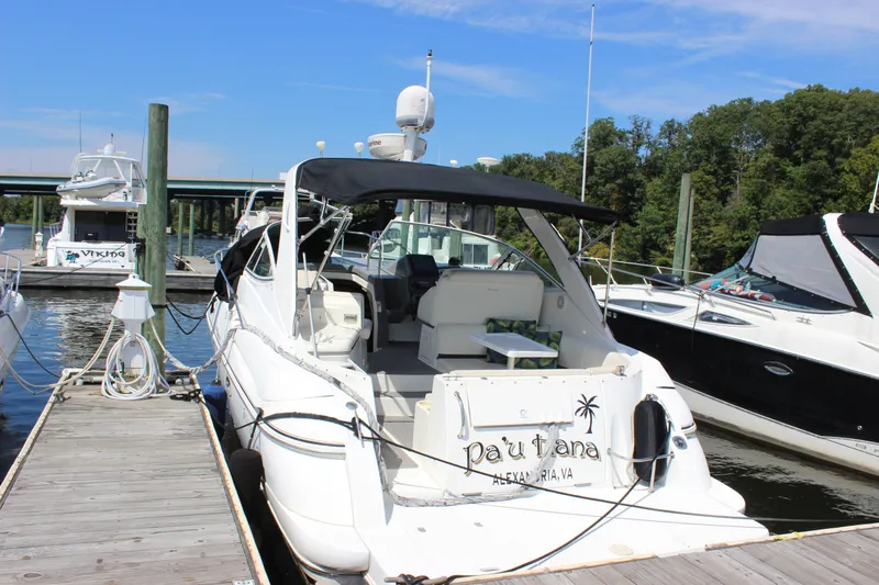 Slide: The Image of 2007 Cruisers Yachts 340 Express docked at marina, featuring sleek design and spacious deck. - 1