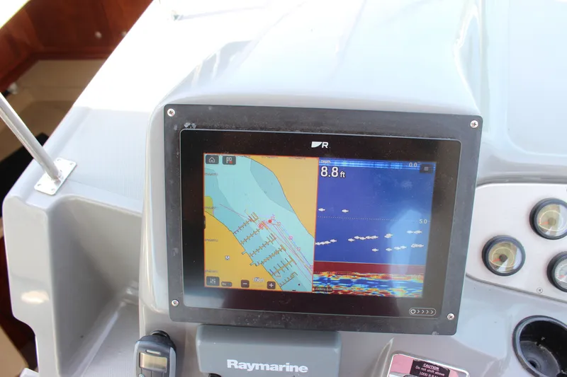 Slide: The Image of Raymarine navigation display on 2007 Cruisers Yachts 340 Express dashboard. - 23