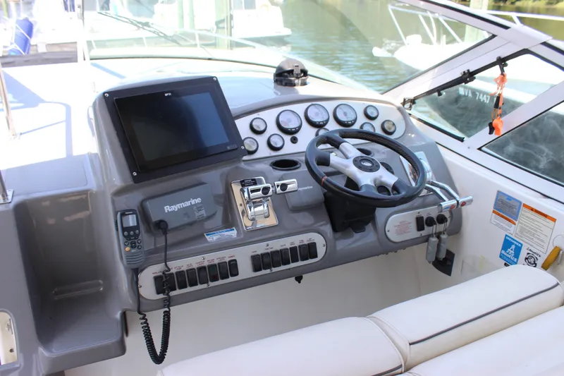 Slide: The Image of 2007 Cruisers Yachts 340 Express helm with Raymarine electronics and modern controls. - 13