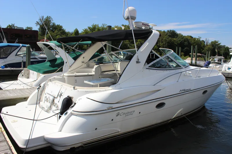 Slide: The Image of 2007 Cruisers Yachts 340 Express docked at marina, side view. - 6