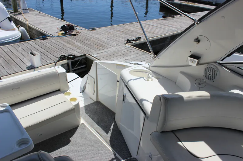 Slide: The Image of 2007 Cruisers Yachts 340 Express interior with seating and dock view. - 16