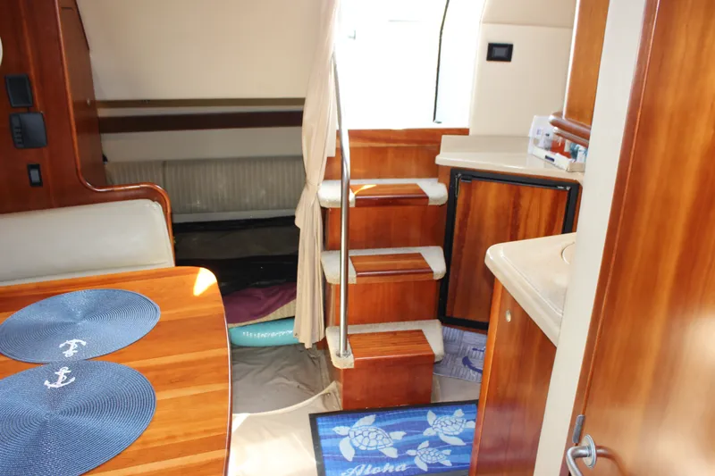 Slide: The Image of Interior of 2007 Cruisers Yachts 340 Express with wooden cabinetry and nautical decor. - 47