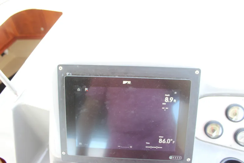 Slide: The Image of Dashboard of 2007 Cruisers Yachts 340 Express showing depth and water temperature. - 19