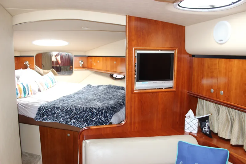Slide: The Image of Luxurious 2007 Cruisers Yachts 340 Express cabin interior with bed and TV. - 35