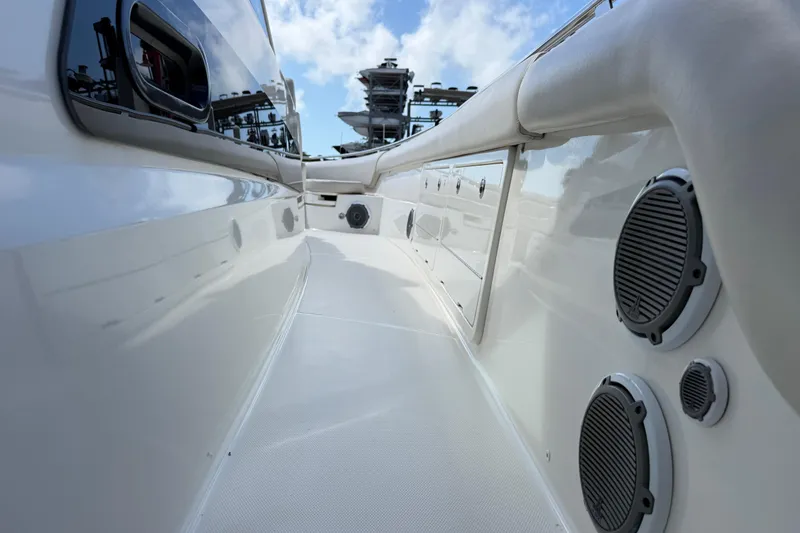 Slide: The Image of 2017 Boston Whaler 420 Outrage boat deck with speakers and sleek design. - 35