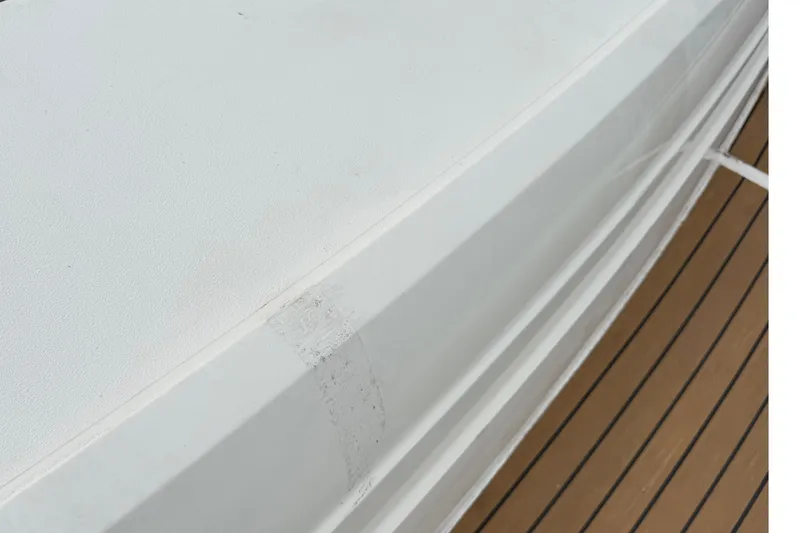 Slide: The Image of Close-up of Fairline Targa 58 yacht deck, showcasing sleek design and wood finish, 2012 model. - 83