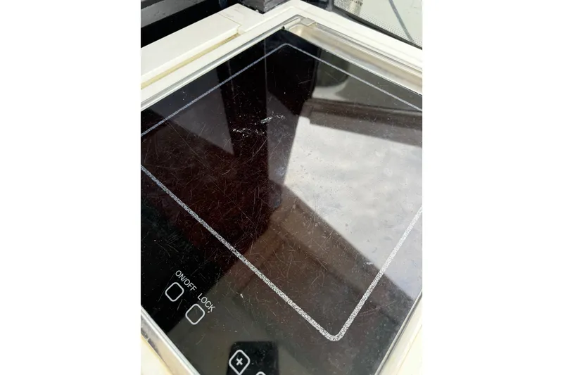Slide: The Image of Induction cooktop on 2012 Fairline Targa 58 yacht, featuring touch controls and sleek design. - 97