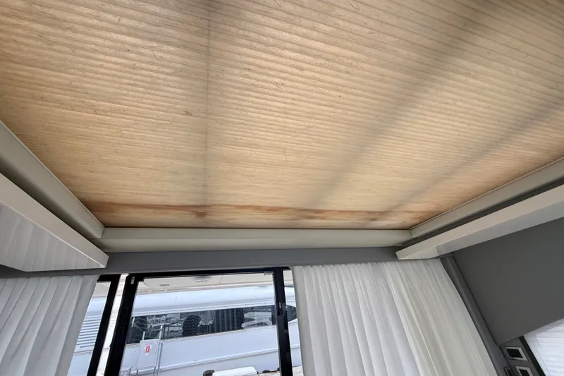 Slide: The Image of Interior ceiling view of a 2012 Fairline Targa 58 yacht with curtains and window. - 73