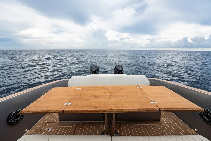 Slide: The Image of 2024 Solaris Power 40F Open yacht with wooden deck table, ocean view. - 37