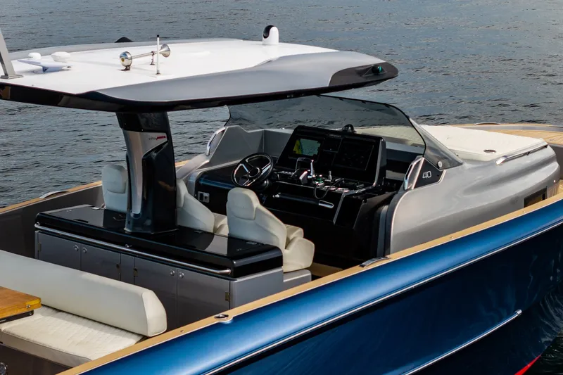 Slide: The Image of 2024 Solaris Power 40F Open yacht interior with modern helm and seating on water. - 16