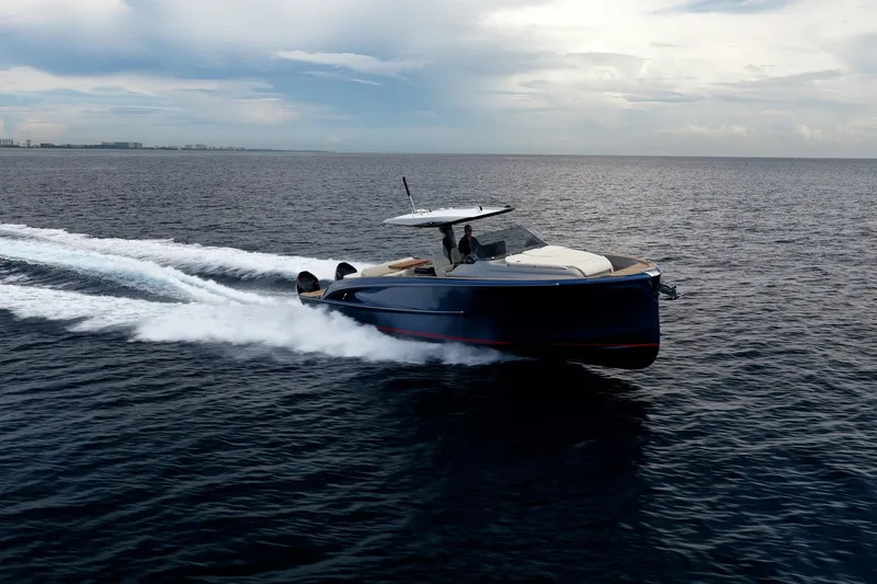 Slide: The Image of 2024 Solaris Power 40F Open yacht cruising on open water under a cloudy sky. - 50