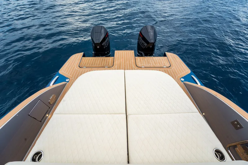 Slide: The Image of 2024 Solaris Power 40F Open yacht with twin outboard engines on calm water. - 32