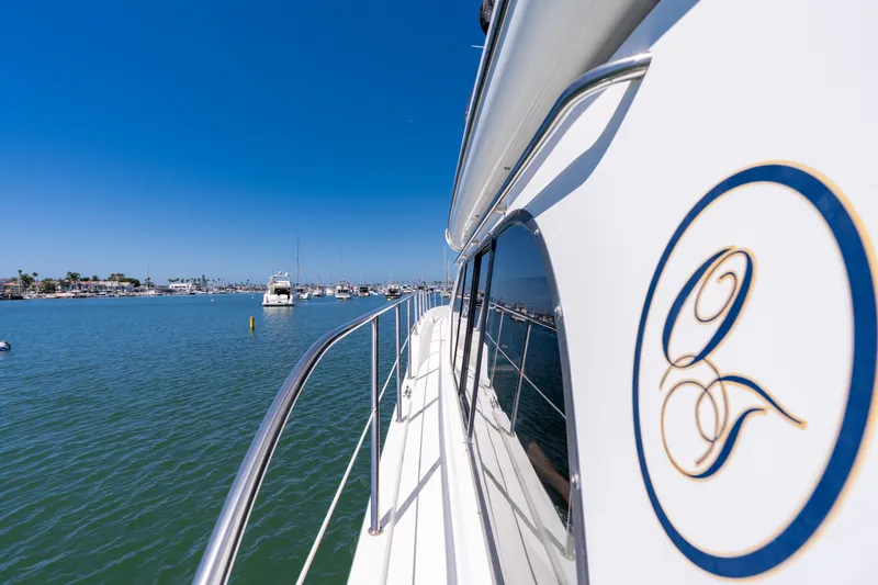 Slide: The Image of 2001 Bayliner 5788 Pilot House Motoryacht cruising in a sunny marina. - 17