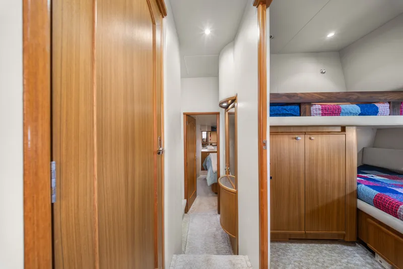 Slide: The Image of Interior of 2001 Bayliner 5788 Pilot House Motoryacht with wood cabinetry and bunk beds. - 29