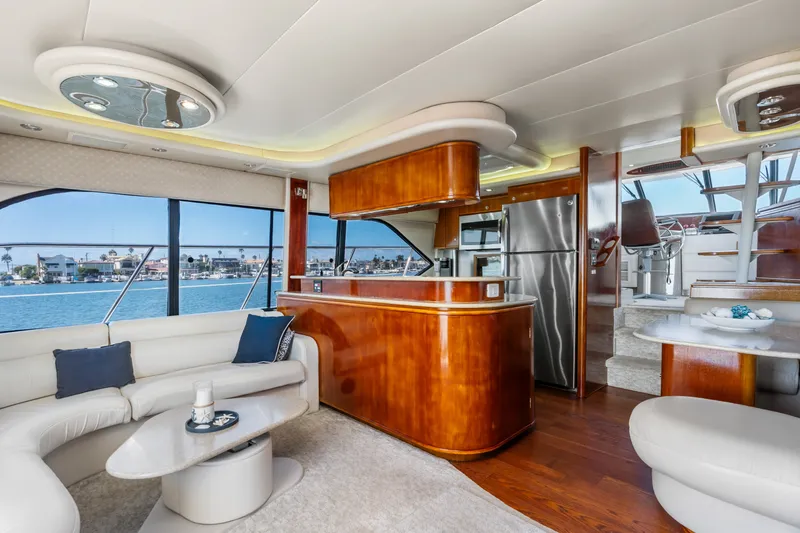 Slide: The Image of Luxurious interior of 2001 Bayliner 5788 Pilot House Motoryacht with elegant wood finishes. - 18