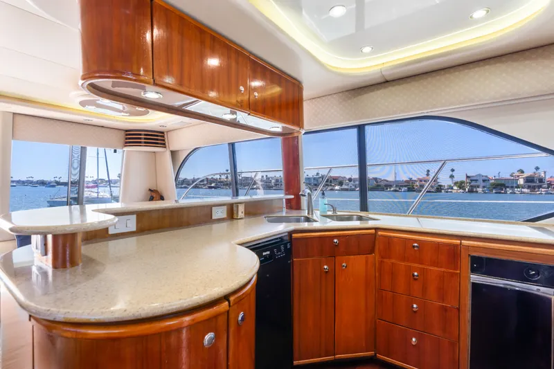 Slide: The Image of Luxurious kitchen interior of 2001 Bayliner 5788 Pilot House Motoryacht with waterfront view. - 22