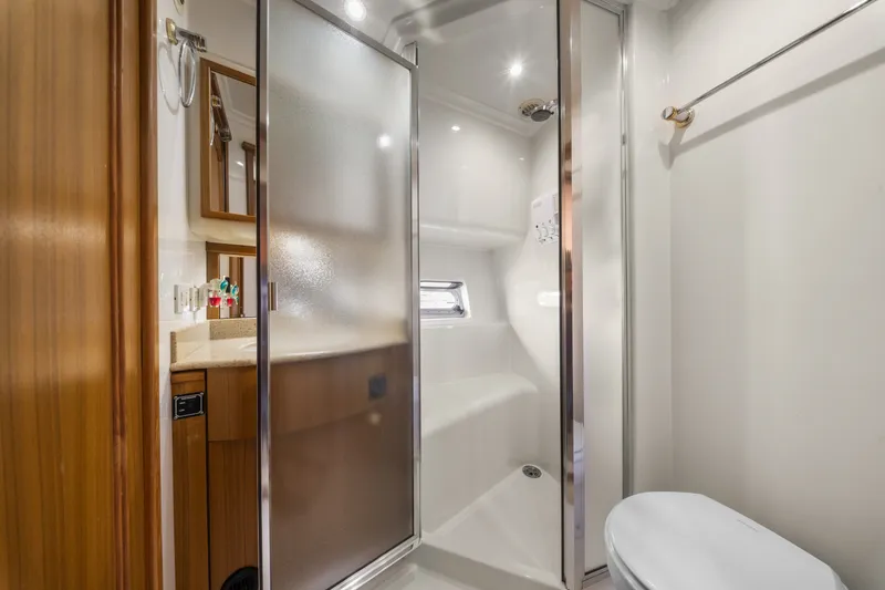 Slide: The Image of Luxurious bathroom in 2001 Bayliner 5788 Pilot House Motoryacht with shower and modern amenities. - 40