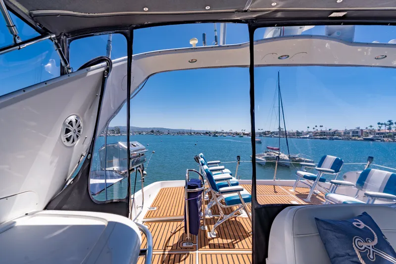 Slide: The Image of 2001 Bayliner 5788 Pilot House Motoryacht deck with ocean view and seating. - 15