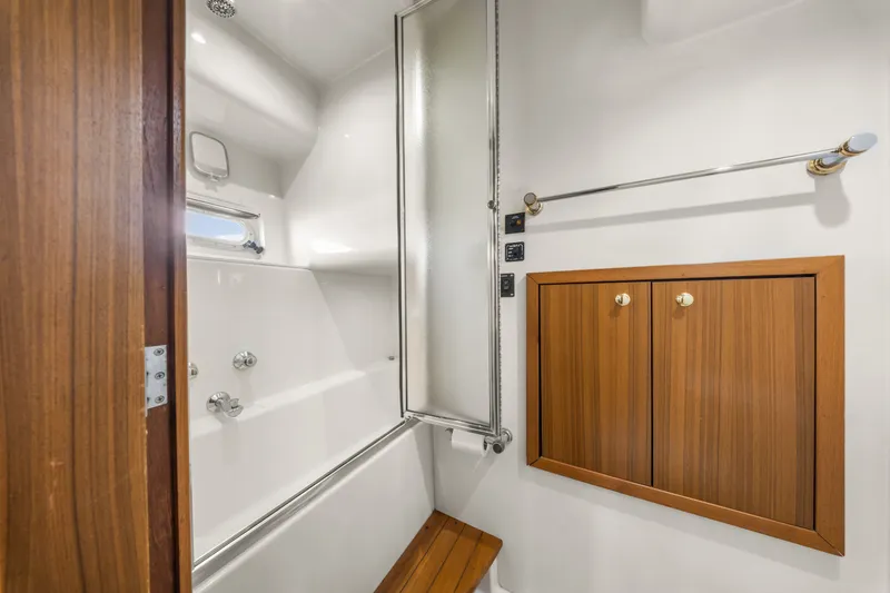 Slide: The Image of Luxurious bathroom in 2001 Bayliner 5788 Pilot House Motoryacht with wooden cabinetry and shower. - 35