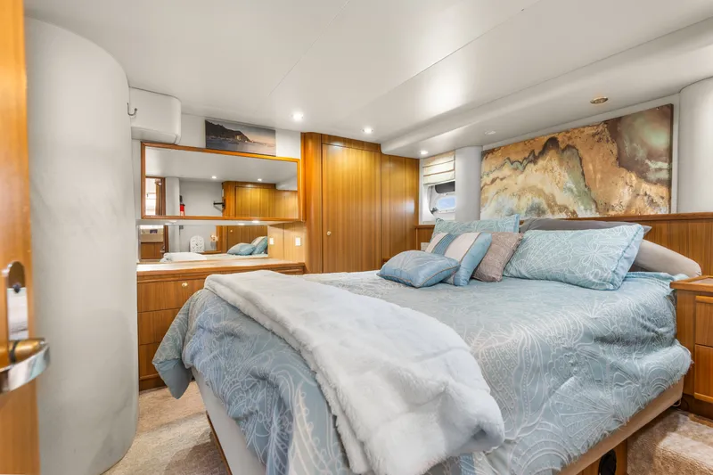 Slide: The Image of Luxurious bedroom in 2001 Bayliner 5788 Pilot House Motoryacht with elegant decor and bedding. - 30