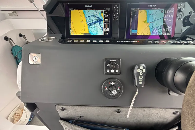 Slide: The Image of Control panel of 2024 Axopar 37 XC Cross Cabin with navigation screens. - 25