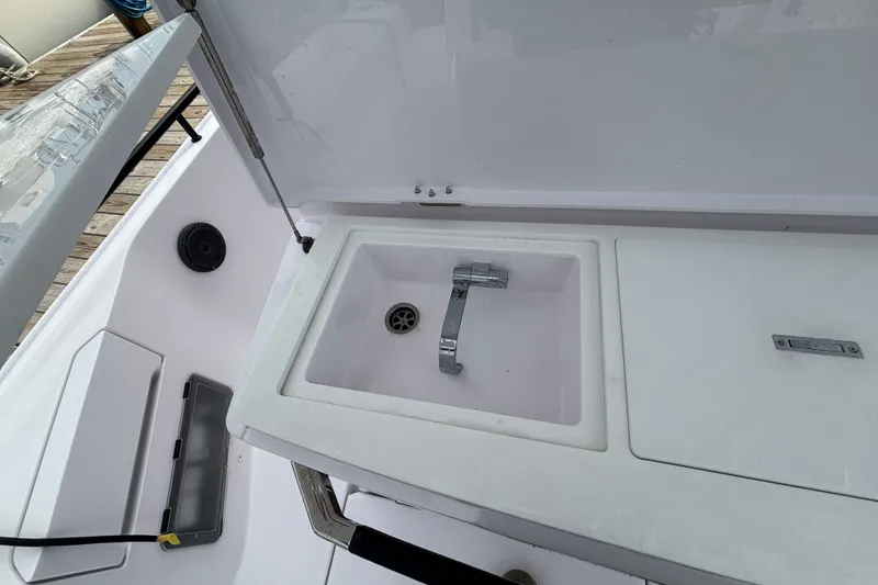 Slide: The Image of 2024 Axopar 37 XC Cross Cabin boat sink and faucet detail. - 13
