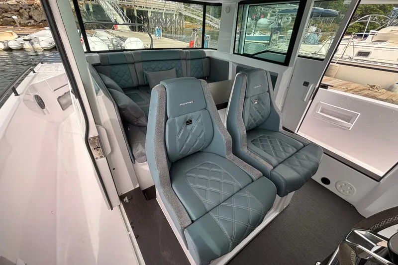 Slide: The Image of 2024 Axopar 37 XC Cross Cabin interior with luxurious seating and modern design. - 18