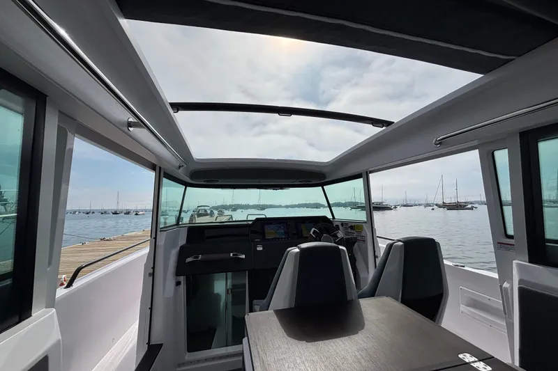 Slide: The Image of Interior view of 2024 Axopar 37 XC Cross Cabin with panoramic windows and sleek design. - 21