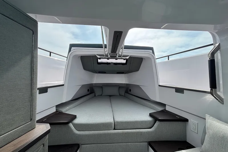 Slide: The Image of 2024 Axopar 37 XC Cross Cabin interior with modern sleeping area and sleek design. - 30