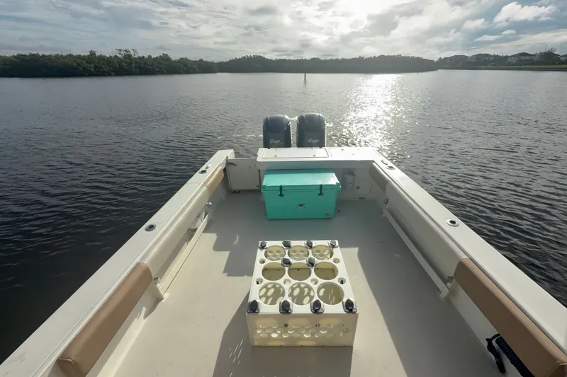 Slide: The Image of 2017 Parker 2810 XLD Walkaround boat on calm water, sunny day. - 11