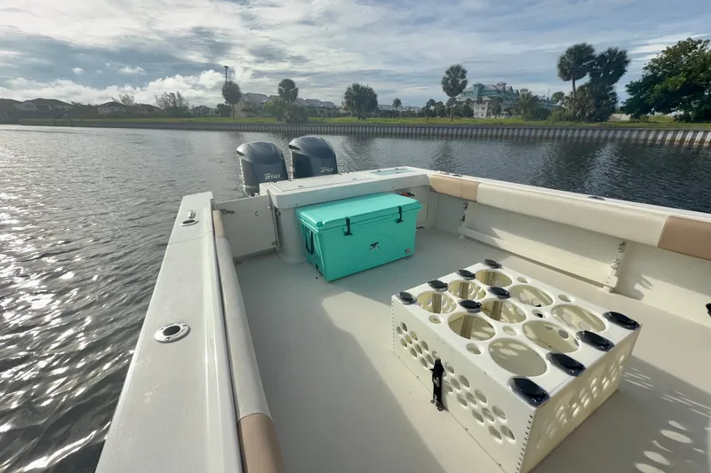 Slide: The Image of 2017 Parker 2810 XLD Walkaround boat with dual engines and turquoise cooler on deck. - 10