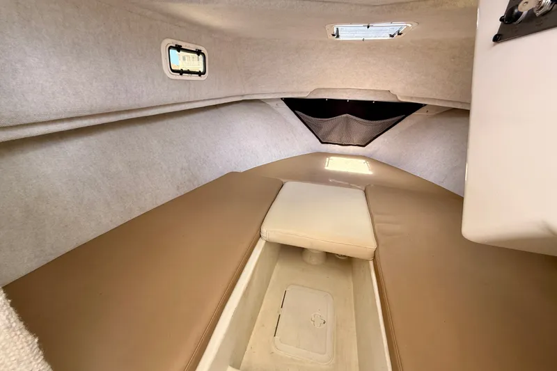 Slide: The Image of 2017 Parker 2810 XLD Walkaround cabin interior with beige cushions and small windows. - 28