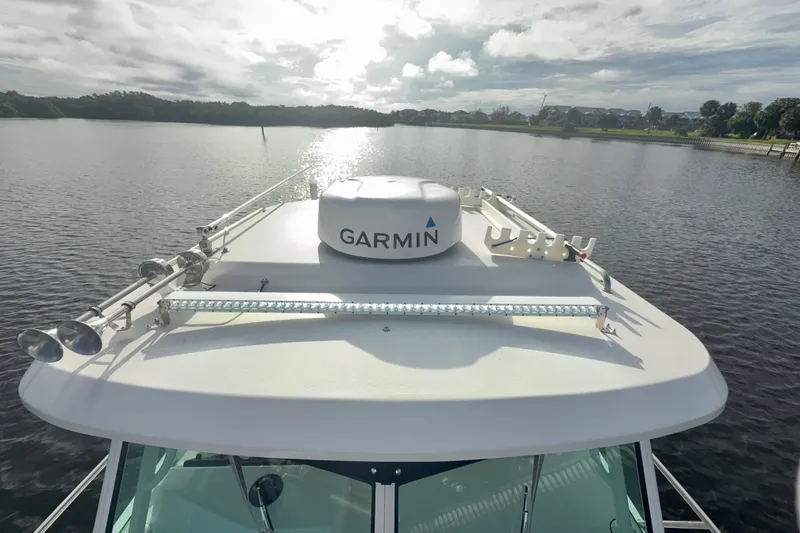 Slide: The Image of 2017 Parker 2810 XLD Walkaround boat with Garmin equipment on a calm lake. - 23