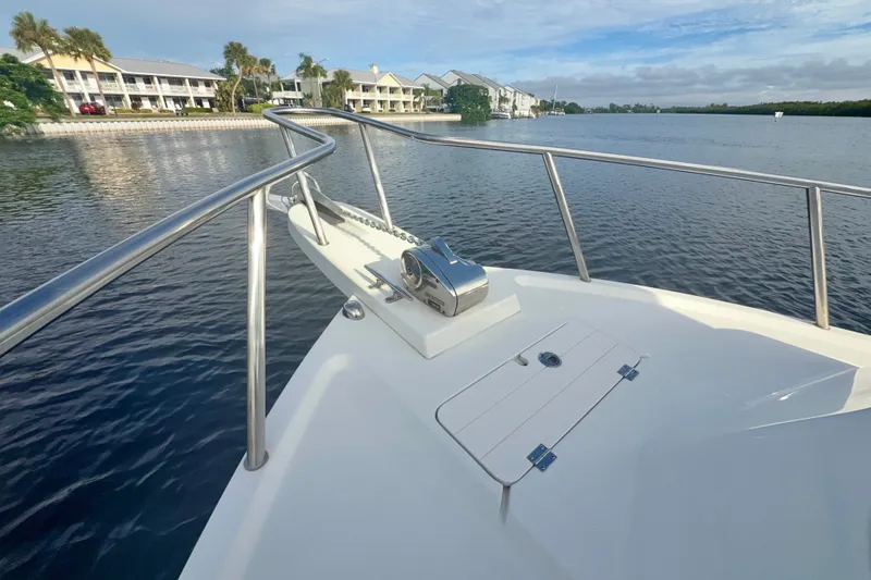 Slide: The Image of 2017 Parker 2810 XLD Walkaround boat on calm water near waterfront buildings. - 25