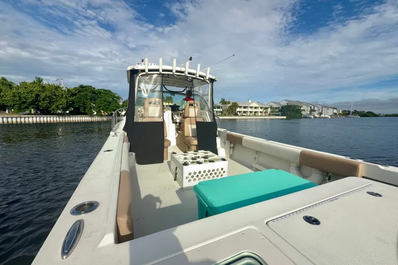 Slide: The Image of 2017 Parker 2810 XLD Walkaround boat on calm water, clear sky background. - 13