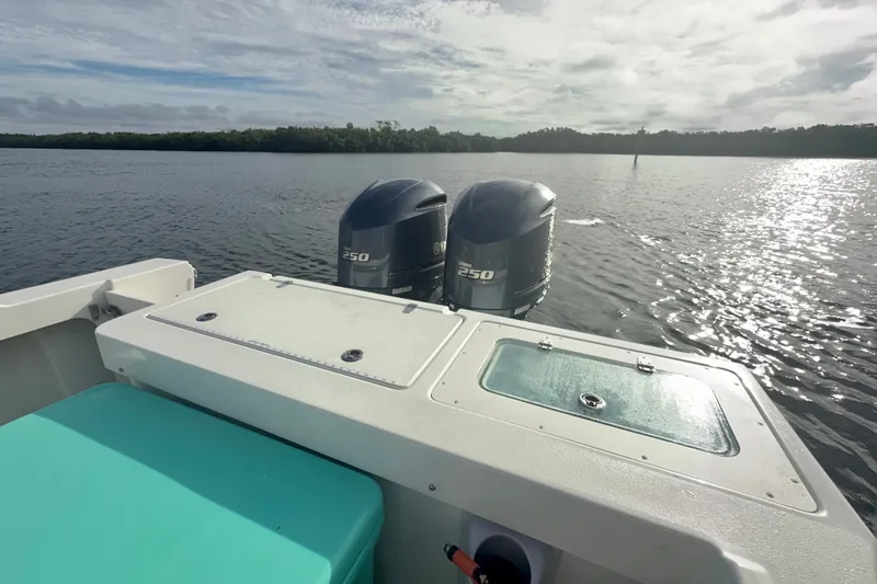 Slide: The Image of 2017 Parker 2810 XLD Walkaround boat with twin 250 engines on a sunny lake. - 15