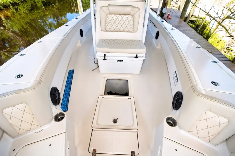 Slide: The Image of 2021 Blue Wave 2800 Makaira boat interior with seating and storage compartments. - 44