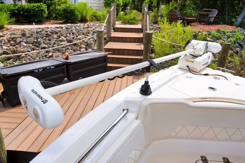 Slide: The Image of 2021 Blue Wave 2800 Makaira boat with Minn Kota trolling motor on deck. - 11