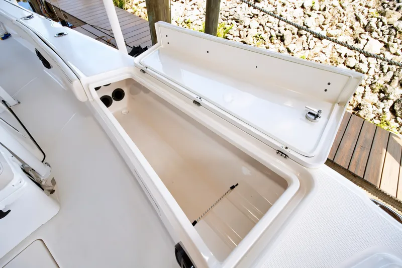 Slide: The Image of Open storage compartment on 2021 Blue Wave 2800 Makaira boat deck. - 41