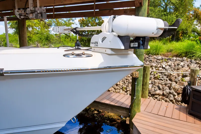 Slide: The Image of 2021 Blue Wave 2800 Makaira boat docked with Minn Kota trolling motor. - 5