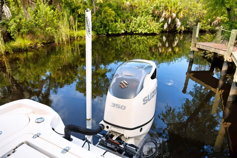 Slide: The Image of 2021 Blue Wave 2800 Makaira boat with Suzuki 350 engine on a calm river. - 16