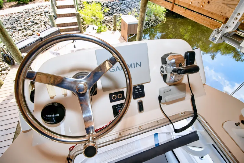 Slide: The Image of 2021 Blue Wave 2800 Makaira boat helm with Garmin navigation system. - 52