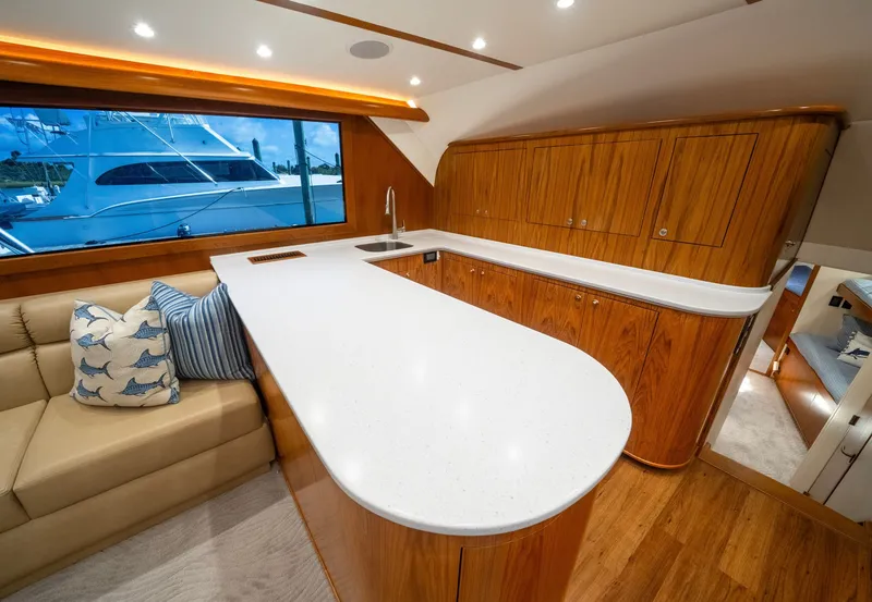 Slide: The Image of Interior of a 2002 Custom Carolina Ritchie Howell yacht with elegant kitchen and wooden cabinetry. - 32