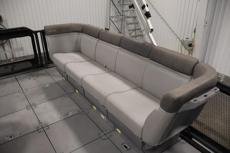 Slide: The Image of 2023 Sea-Doo Switch 16 interior with gray seating and modular floor design. - 23